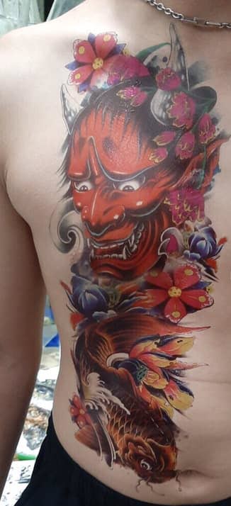 Half-human devil carp tattoo